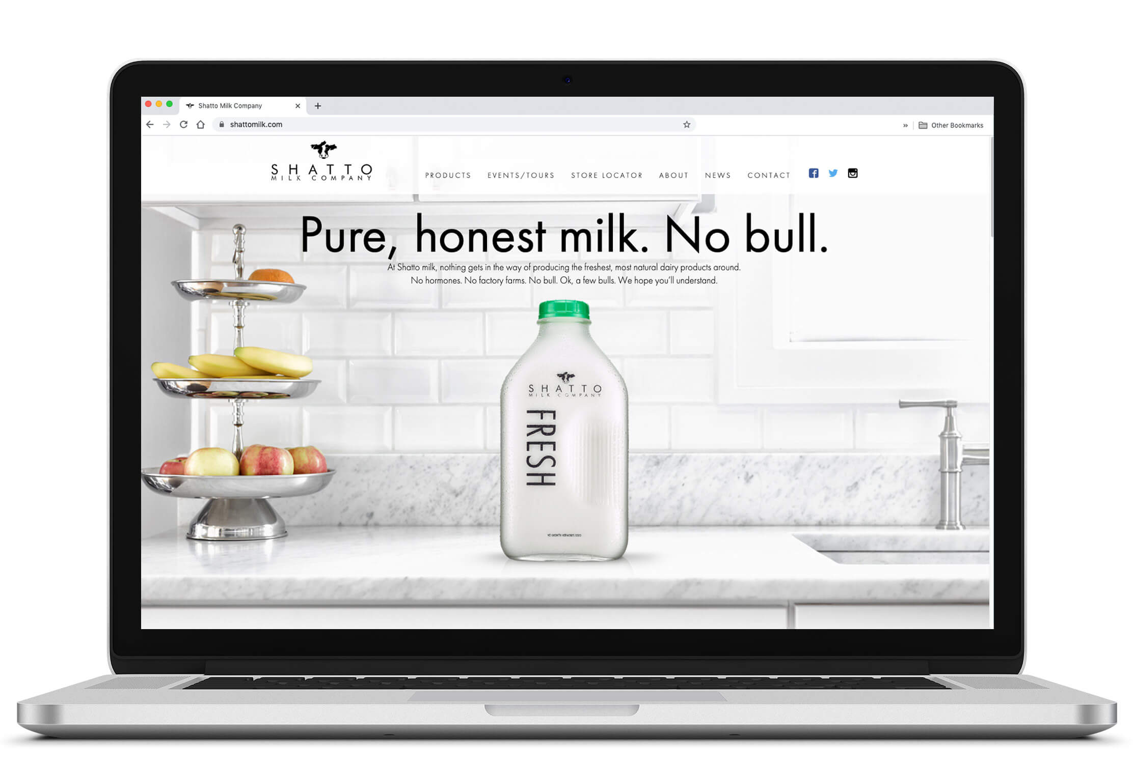 Laptop showing Shatto Milk Company website home page.