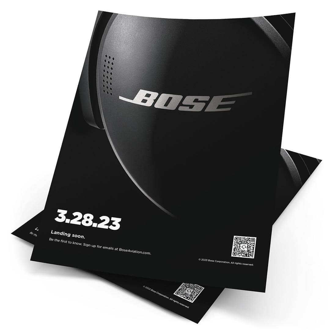 Print ad – mostly all black with an extreme close up of Bose logo on A30 headset and a headline of 3.28.23